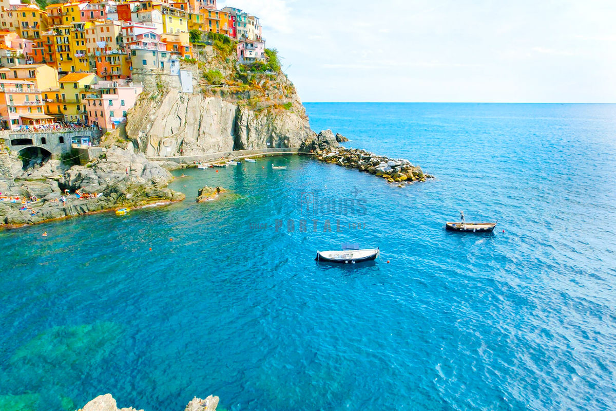 Colorful Traditional Houses on a Rock Over the Mediterranean Sea, Italy - Egypt Tours Portal