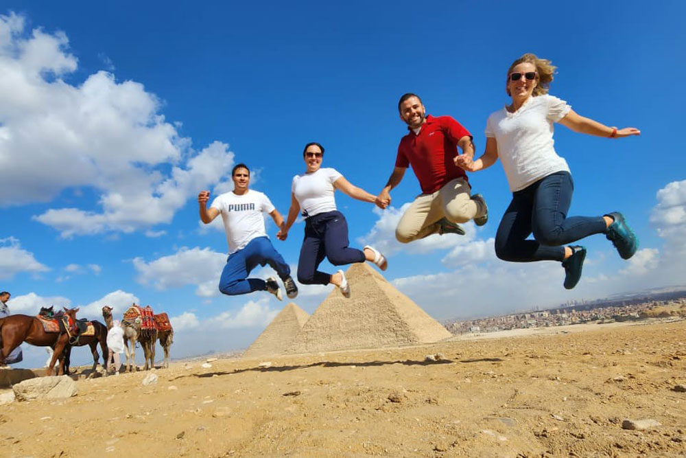 Friends Taking Great Photos in the Front of the Pyramids by One of Egypt Tours Portal Team