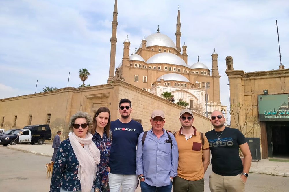 Friends of Four Men & Two Women Enjoying Their Trip in Saladin Citadel With Egypt Tours Portal