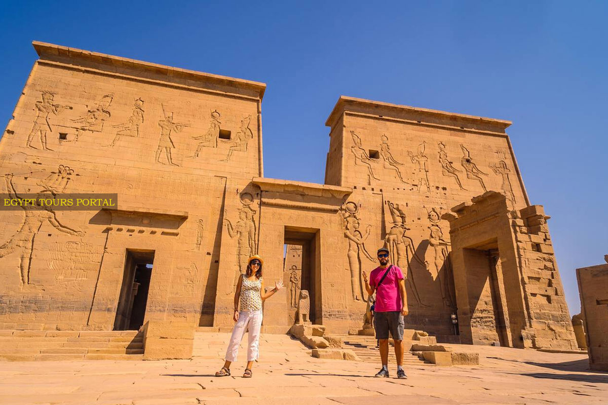 Couples in the Front of Philae Temple - Egypt Tours Portal