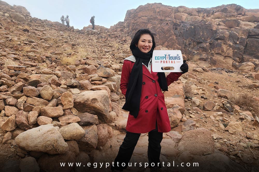 Female Guest of Egypt Tours Portal at Sinai Mountain - How to Enjoy Egypt as a Solo Traveler - Egypt Tours Port