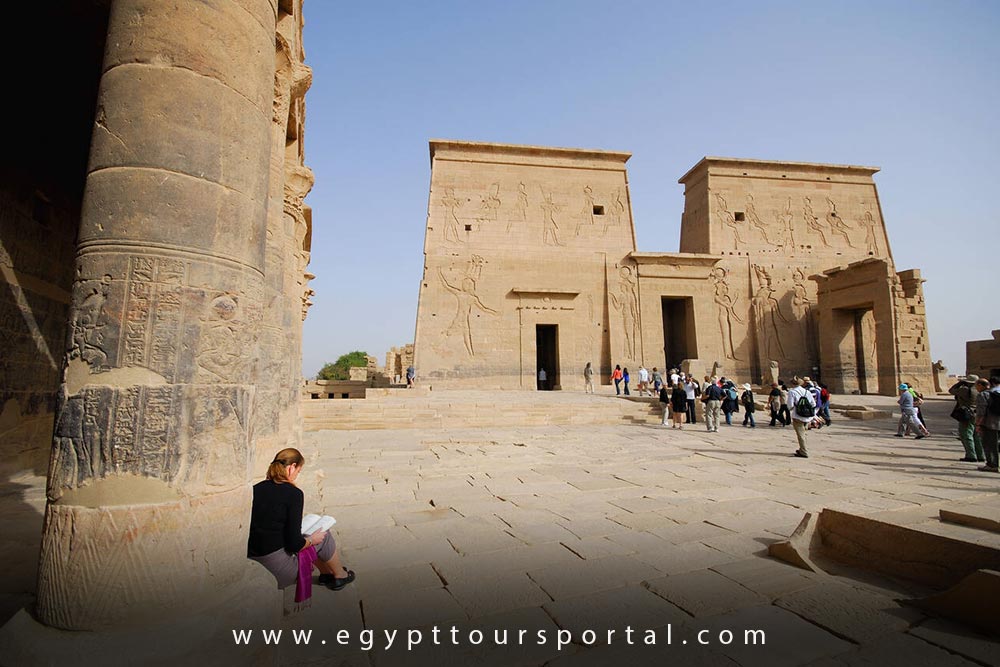 Female Tourist Visit Philae Temple - How to Enjoy Egypt as a Solo Traveler - Egypt Tours Portal