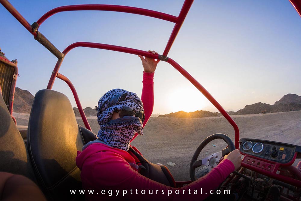 Female Tourist Wearing Sunglasses and a Scarf Goes on Safari in the Hurghada Desert - How to Enjoy Egypt as a S